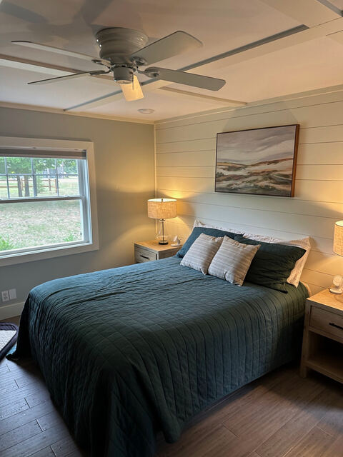 Primary bedroom with ceiling fan and queen bed
