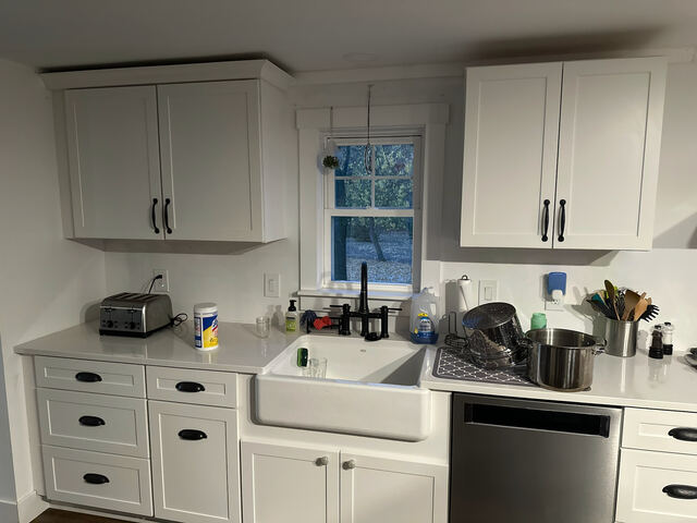 Kitchen farmhouse sink and cabinetry detail
