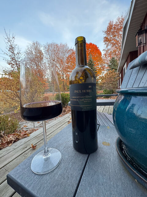 Glass of wine on the deck at dusk