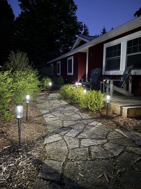 Stone path with landscape lighting at dusk