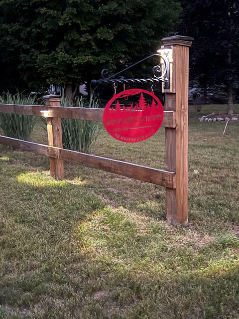 Property address sign with evening lighting