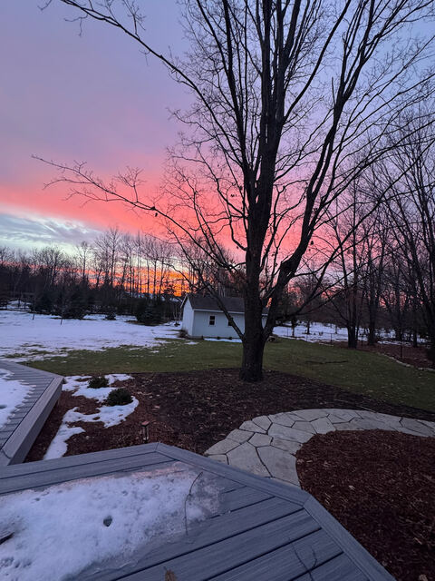 Sunset sky over the snowy property